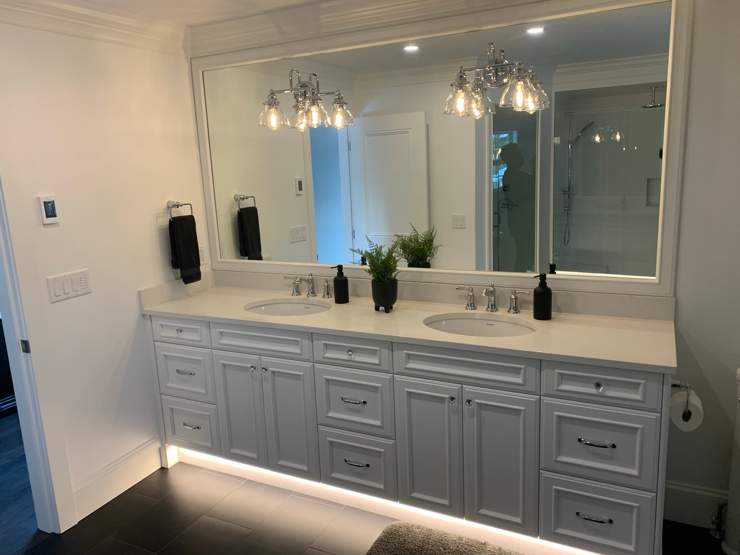 Master bathroom with double quartz vanity and LED lighting — Abbotsford BC