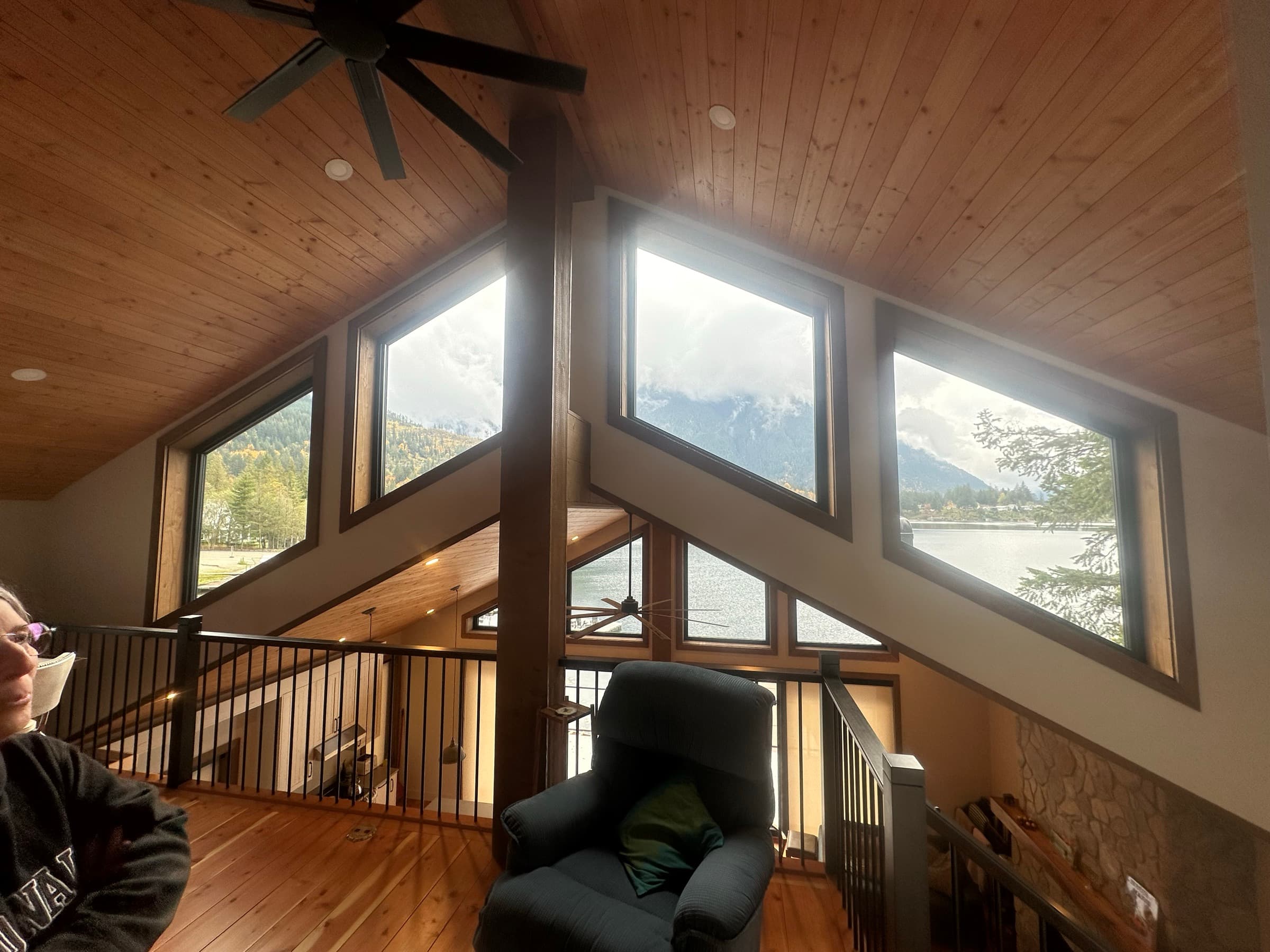 Cabin renovation with vaulted pine ceiling and lake-and-mountain view — BC