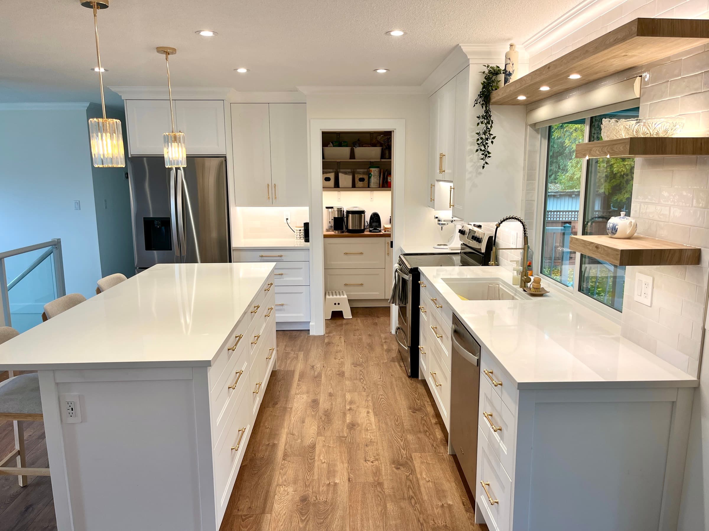 White kitchen with gold hardware, tile backsplash and open wood shelves — Fraser Valley